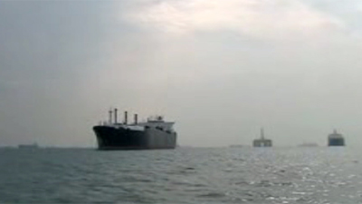 Emply cargo vessels moored off S. Malaysia