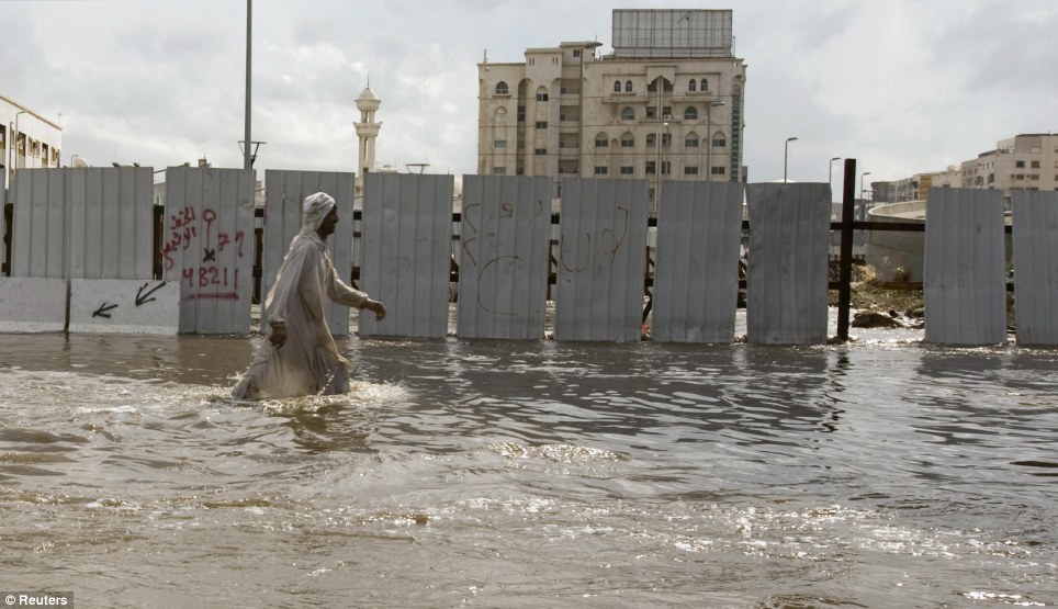 jeddah floods sewage saudi arabia photo man streets walking