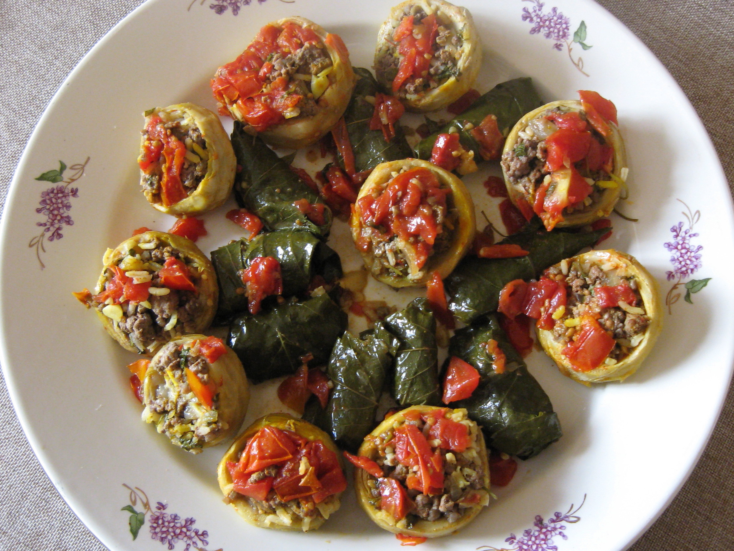 Plateful of stuffed artichoke hearts and vine leaves