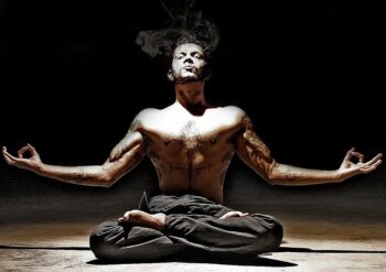 man in lotus position doing yoga