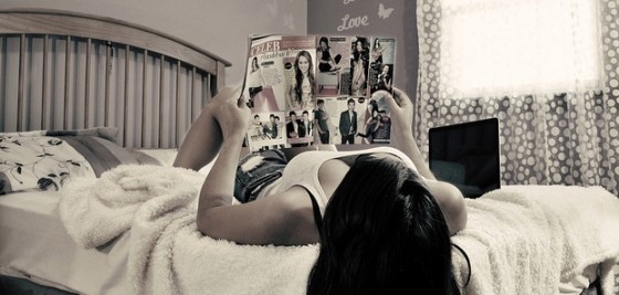 teen reading magazine