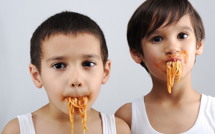 boys eating spaghetti
