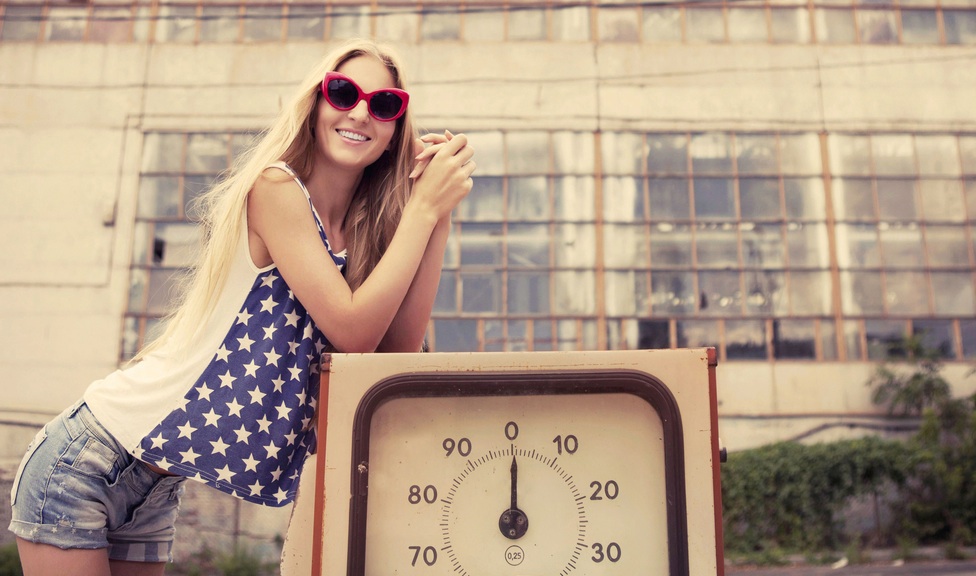 american girl at a gas pump