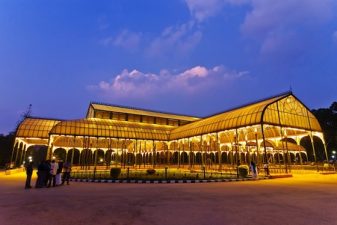 Nanophotonic Building Panels Beam Sunlight and Heat into Cold Space