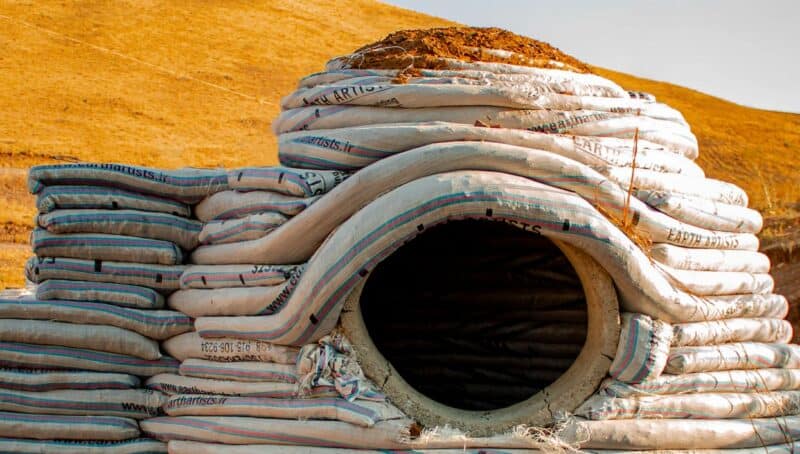 round home window installation, curved wall window solution, eco architecture window design, window in round room, sustainable circular house design, curved wall glazing, dome home window example, natural building window framing, round wall daylighting, curved architecture window detail, passive solar window in round room, eco-friendly home design, window buck in curved wall, wood frame insert for round home window, earthbag dome window buck, flat window frame in dome house, rectangular window in round room, inflatable concrete house window buck, superadobe window frame detail, embedded window box in curved earthbag wall, sustainable window install, monolithic dome window mounting, flat plane window insert, eco building techniques window buck, arched window in adobe home, vaulted opening in round wall, traditional earthen window design, adobe arched window reveal, curved adobe wall with arch window, passive cooling arched window, superadobe arched window form, earth architecture arch window detail, natural building vault window, thick wall arched reveal daylighting, eco desert architecture window, flat section in dome wall for window, buttress window design in round home, earthbag flat window mount, curved house with flat window panel, round room partial flat wall for window, hybrid curved-flat wall glazing, eco resort dome window flat area, sustainable home buttress window example, round-house window detail, porthole window in dome home, circular window in curved wall, eco dome porthole glazing, inflatable concrete house porthole window, small round window in adobe wall, marine-style window in dome, tiny home with circular window, storm-resistant dome porthole window, monolithic dome circular window, bubble house porthole window, minimalist round window design, recessed window in thick curved wall, passive cooling window reveal, inward-tilted window opening, deep window niche in adobe home, desert architecture recessed window, round wall window shading, tilted window frame ventilation, natural cooling window channel, curved wall window recess design, Mediterranean vernacular window recess, thick-wall window shading technique, eco passive design window