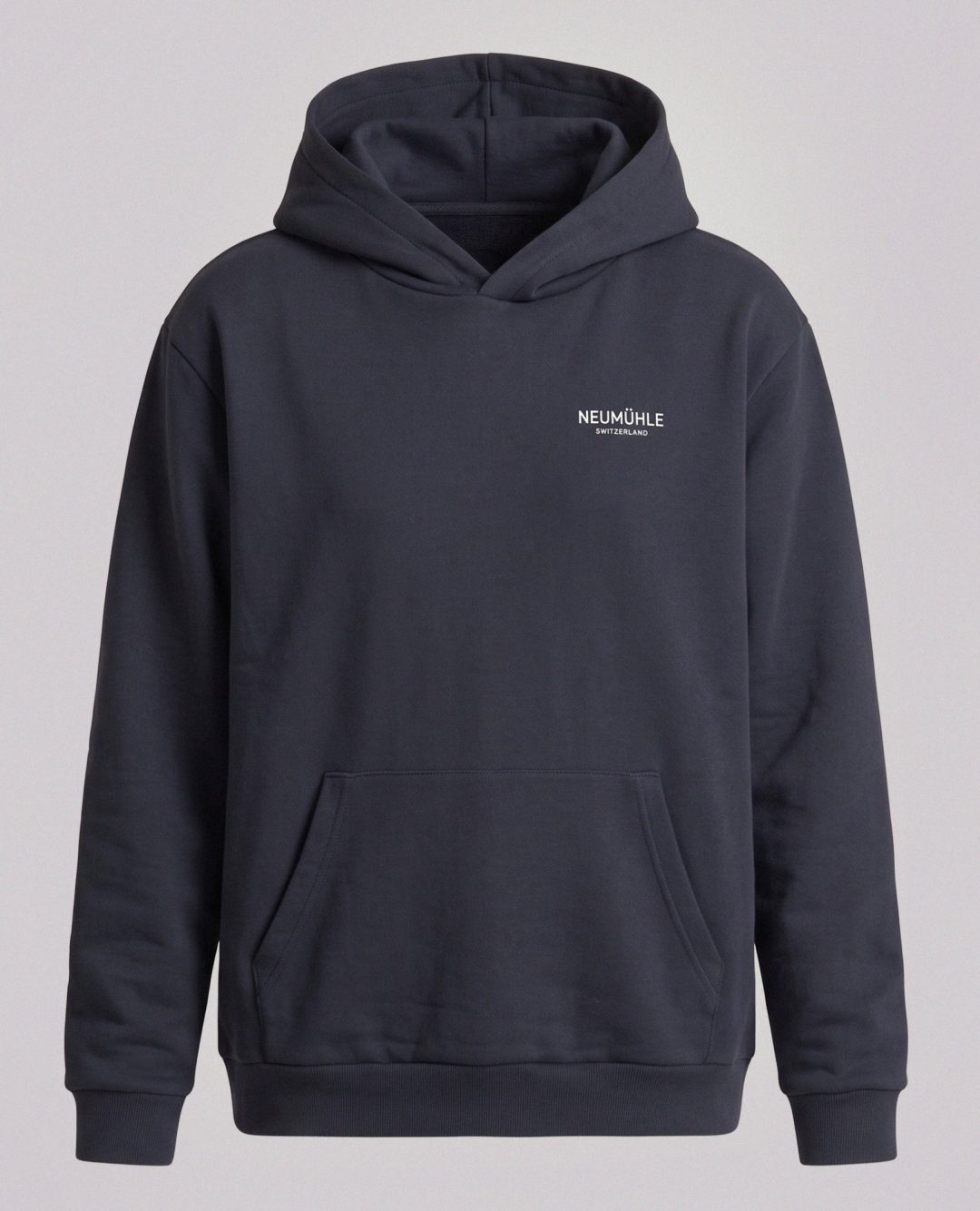 A plain hoodie with a bigger message: fewer mixed fibers can mean fewer recycling complications and less reliance on synthetic materials.