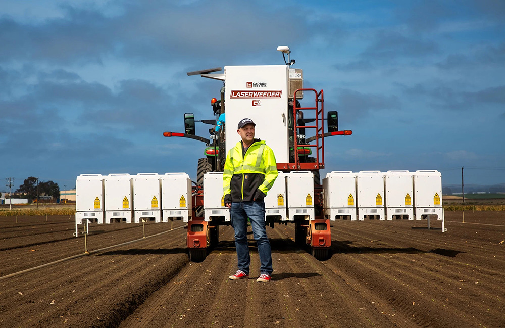 Carbon Robotics founder and CEO Paul Mikesell with the LaserWeeder G2. | Source: Carbon Robotics