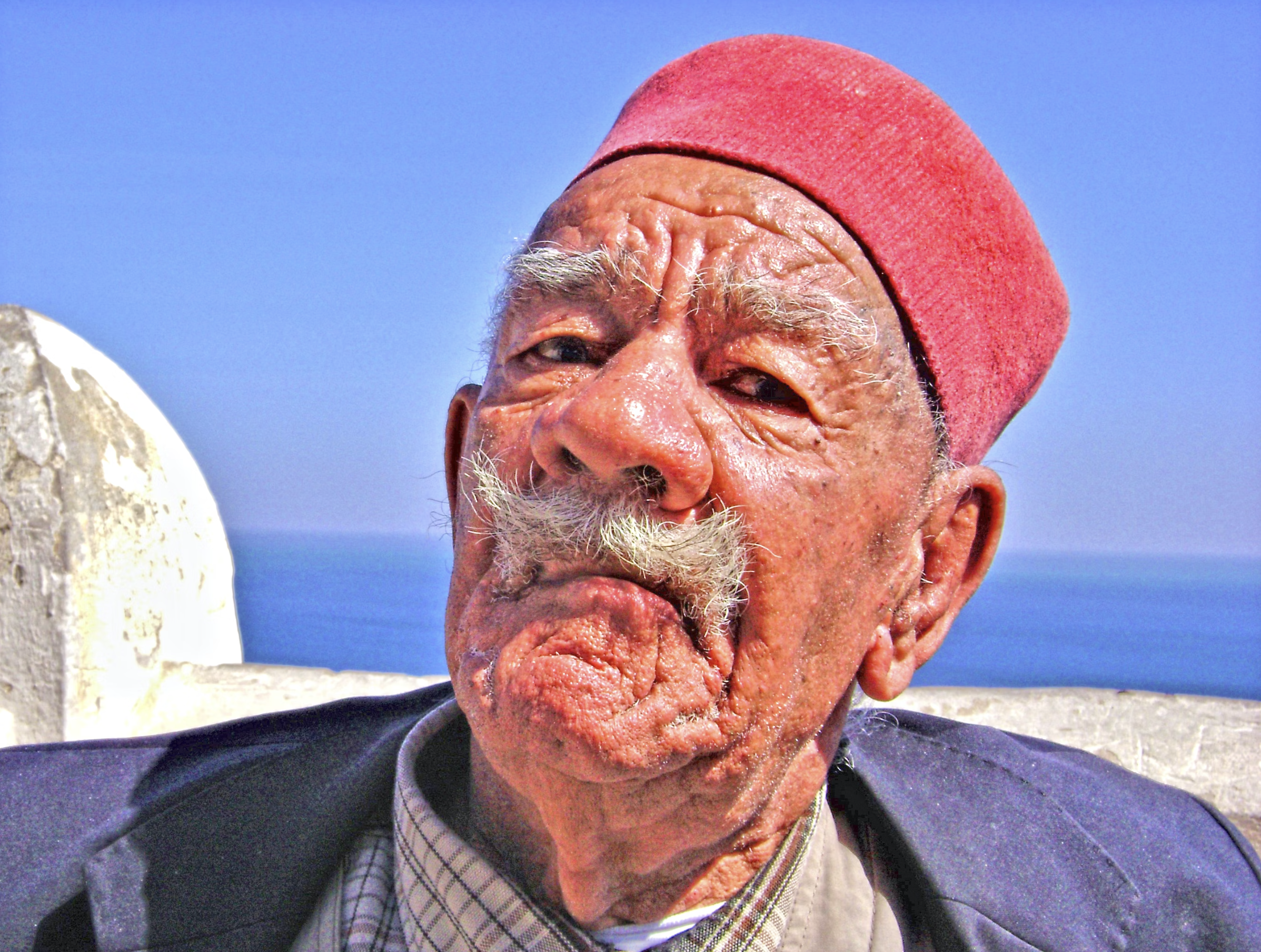 Algeria man with red fez hat
