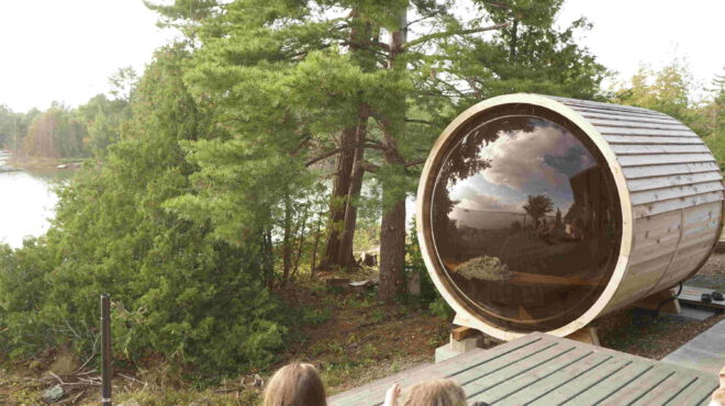 Barrel sauna, panoramic window, serene beauty, lush forest, precision-crafted, cylindrical design, nature integration, wellness experience, unobstructed view, tranquil ambiance, rustic charm, modern functionality, charming retreat, contemporary luxury, natural splendor, rejuvenating journey, heart of the forest, sauna escape, forest sanctuary, soothing warmth, panoramic serenity.