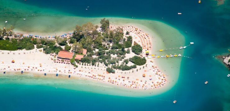 blue-flag-Turkey-beach-Oludeniz-from-a-paraglide-birds-eye-view-Fethiye-Turkey.jpg