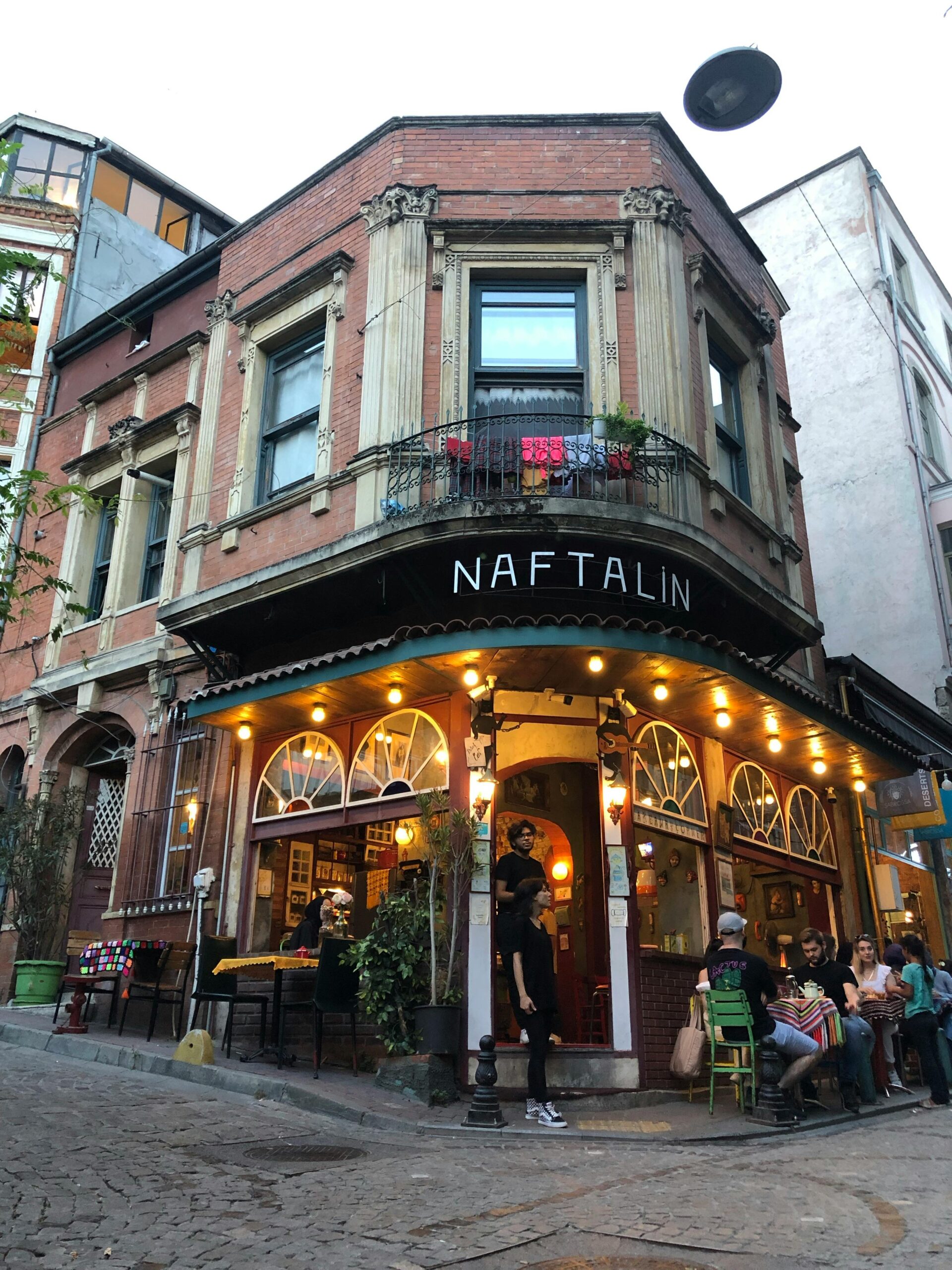 Cafe Naftalin in Balat, Istanbul, with a street cat nearby