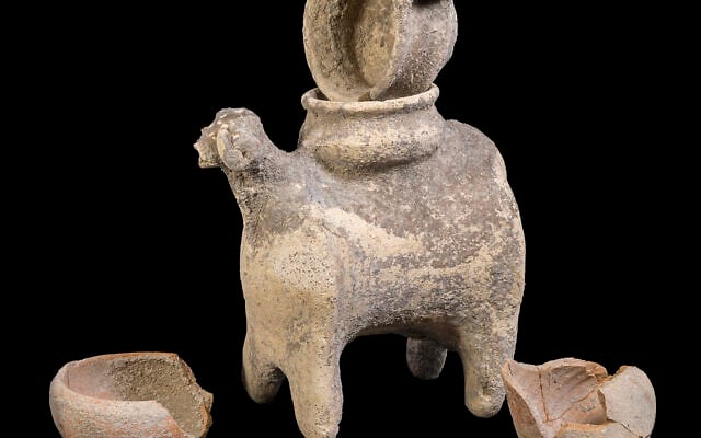 Several 3,300-year-old Canaanite artifacts, including a ram-shaped vessel, were unearthed in archaeological excavations along Highway 66, near Tel Megiddo in northern Israel, in a discovery announced on November 5, 2025. (Katerina Katzan/Israel Antiquities Authority)