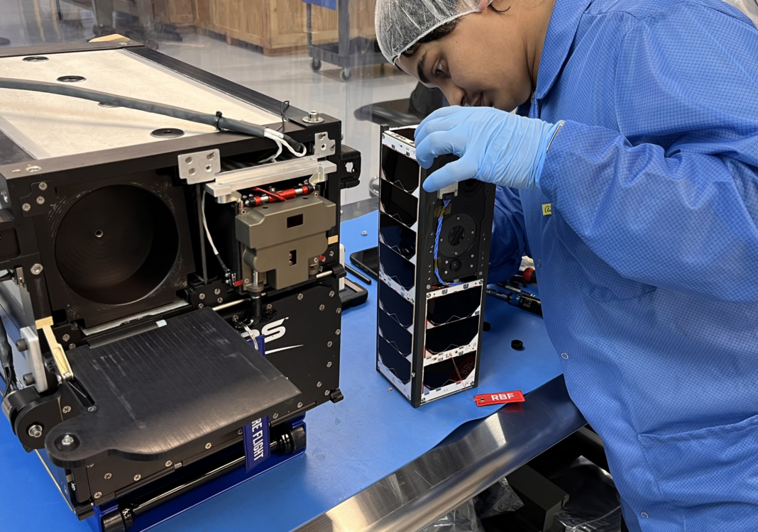 A multidisciplinary team of undergraduate students led by the University of New Hampshire designed and built a mini satellite, known as a CubeSat, that will launch into space to gather data in collaboration with NASA’s Interstellar Mapping and Acceleration Probe (IMAP) mission. The small-but-mighty satellite is set to launch on a SpaceX rocket from Vandenberg Space Force Base in California no earlier than Nov. 10, 2025 at 10:19 a.m. PST. It will head to the outer reaches of the atmosphere to study the solar wind which will help scientists in their quest to improve space weather forecasting and better protect technology in space and on Earth—such as communication networks, power grids and GPS—from potentially damaging large solar flare events. “This is an amazing opportunity for UNH students to not only get hands-on technical experience but to also collaborate with other undergraduates across the country to design and build an entire space mission from the instrument to the software that will operate it in space and the antenna and radio to command the satellite once there,” said Noé Lugaz, research professor in physics and astronomy at the University of New Hampshire. “The experience is invaluable and can open doors to future opportunities in space-related or other science and engineering careers.” A team of 70 undergraduate students from the University of New Hampshire (UNH), Sonoma State University (SSU) and Howard University (HU) designed, developed and built the satellite which was named 3UCubed—reflecting the overall concept of uplifting undergraduate students to study upwelling, and giving a nod to the three participating universities. Selected as part of NASA’s CubeSat Launch Initiative, once it is launched, the satellite will travel to the Earth’s upper atmosphere, known as thermosphere, which is the same region where many other satellites and the International Space Station orbit around Earth. It will take measurements of the atmosphere density (single oxygen at this altitude) and electron precipitation from space onto the upper atmosphere, which can cause disturbances in communication signals and lead to changes in the ozone. Data from the mission will be collected by the students and analyzed in combination with data from IMAP and will help advance the understanding of how the thermosphere in the auroral and cusp regions responds to particle precipitation and varying conditions associated with solar wind. CubeSats are a specific subset of satellites that are small and standardized and provide a cost-effective way to study space science. It is about the size of a loaf of bread and offers a simpler way to start building and operating than larger satellites, making it an ideal piece of equipment for students to hone their skills outside of the classroom. The 3UCubed satellite was fully assembled at UNH and the two payload instruments that are a part of its structure were built, tested and calibrated at UNH. The students worked for five years on the satellite, performing a variety of tasks ranging from creating the software code that controls the 3UCubed to soldering the wires during the physical build. Students with mentorship from professors and staff engineers, performed trade studies, orbit analyses, selected vendors for different subsystems, oversaw budgets for various mass, power, link and telemetry jobs and developed the framework for the flight software and operations. “At the time, I had a keen interest for the aerospace industry and saw this as a great opportunity to get valuable experience working with industry professionals,” said Alex Chesley ’22, who studied mechanical engineering at UNH and was a part of the 3UCubed mission team. “It was fascinating to learn about so many new subjects about space science and instrumentation that I had never studied before.” The hands-on experience is meant to introduce, inspire and prepare students for a successful career in a related field like space science, computer science, engineering or science education. Chesley designed the initial CAD model of the satellite and also helped create the detailed specification list for the CubeSat’s altitude control system. He now works as a configuration engineer at STS Aerospace in Laconia, N.H., where he helps develop fluid distribution systems for customers in the space, aeronautics and defense industries. “The experience with the 3UCubed mission helped with my professional growth, and it was definitely valuable to have, no matter what industry you end up working in,” said Chesley. Students from UNH also took the lead in developing the instrument software and worked with students from SSU on the flight software. SSU oversaw the development of the software for the ground station and will serve as the primary ground station for the mission, which will collect the data from the satellite and will send commands to the spacecraft so it can adjust once it is in orbit. UNH worked with HU to build the back up ground station. Students from Sonoma State University have also engaged with their region’s amateur radio operators and Scout members to construct a ground station for them to communicate with the satellite.