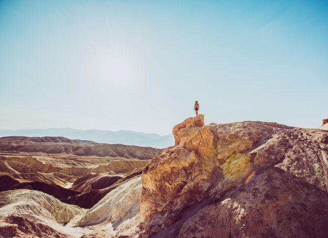 death valley and man overlooking mountain