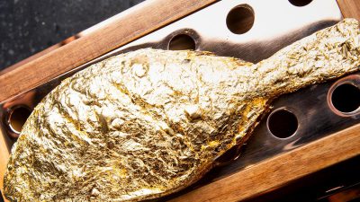 Gold instead of cinnamon on cappuccinos in Arab states as poverty reels on nearby