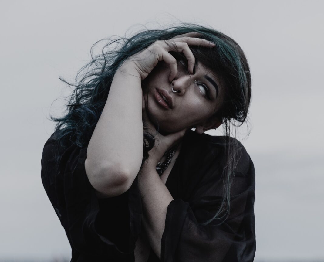 women making evil eye