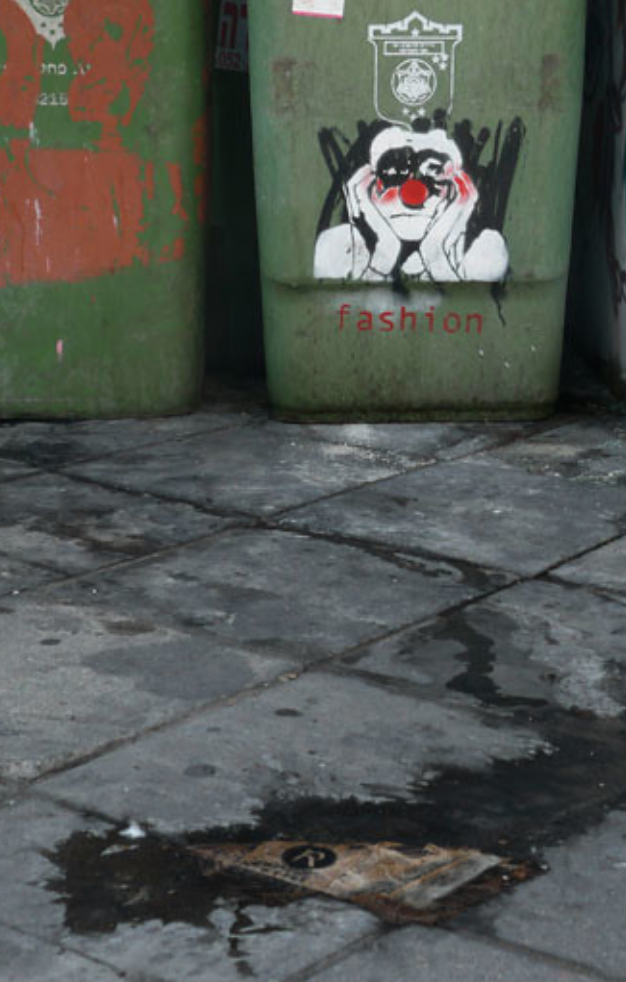 graffiti on a garbage bin in Tel Aviv, about fashion