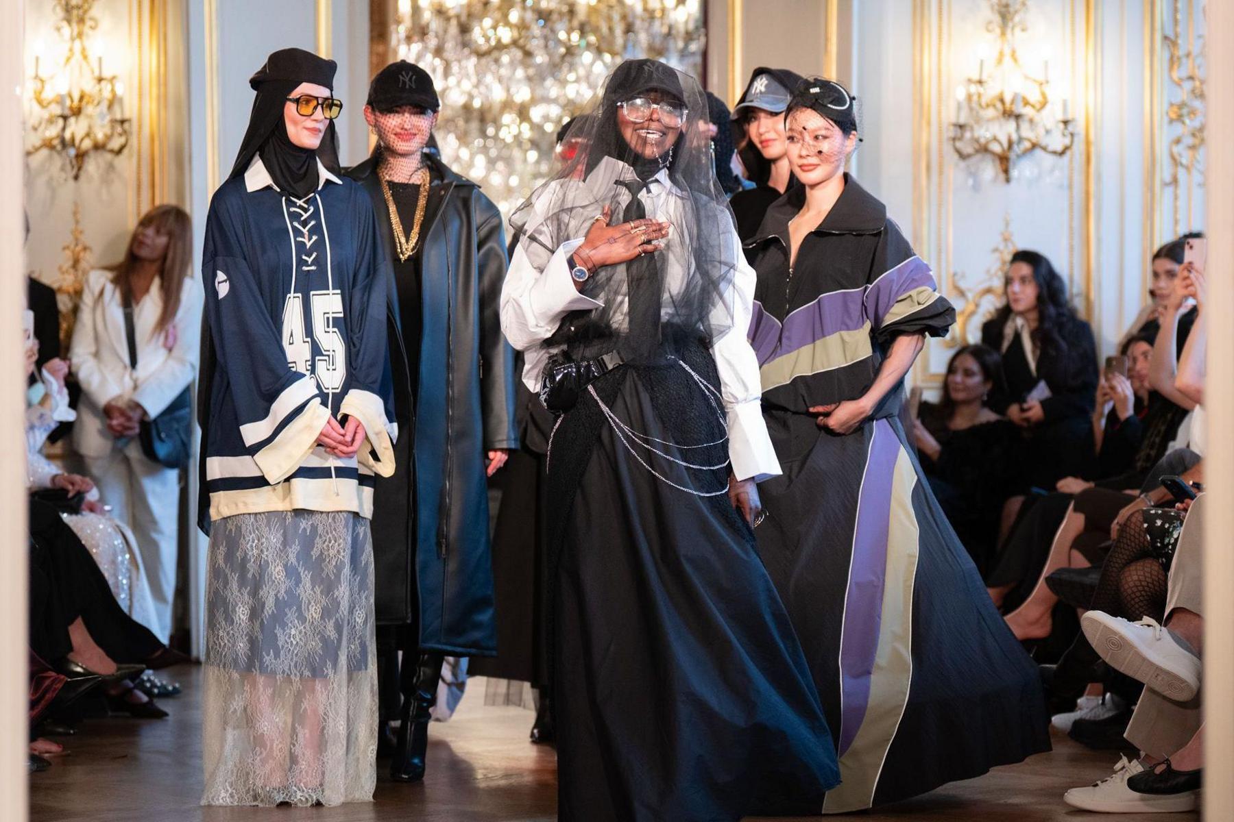 French designer Fatou Doucouré (centre) said exhibiting her designs in Paris made her feel women who wear headscarves could "take on any role in society"