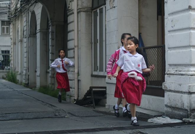 chinese girls running down the street