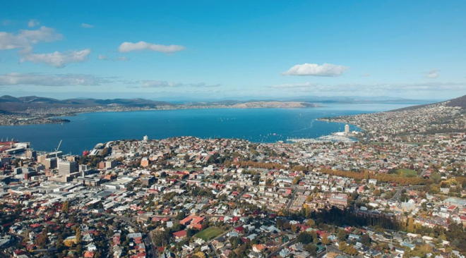 Aerial panoramic view of Hobart, Tasmania's capital, spread along the wide Derwent River