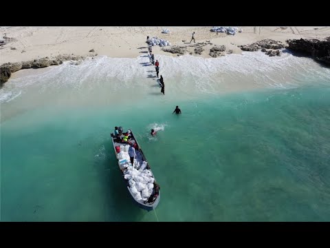 boat loaded with plastic and flipflops in the seychelles