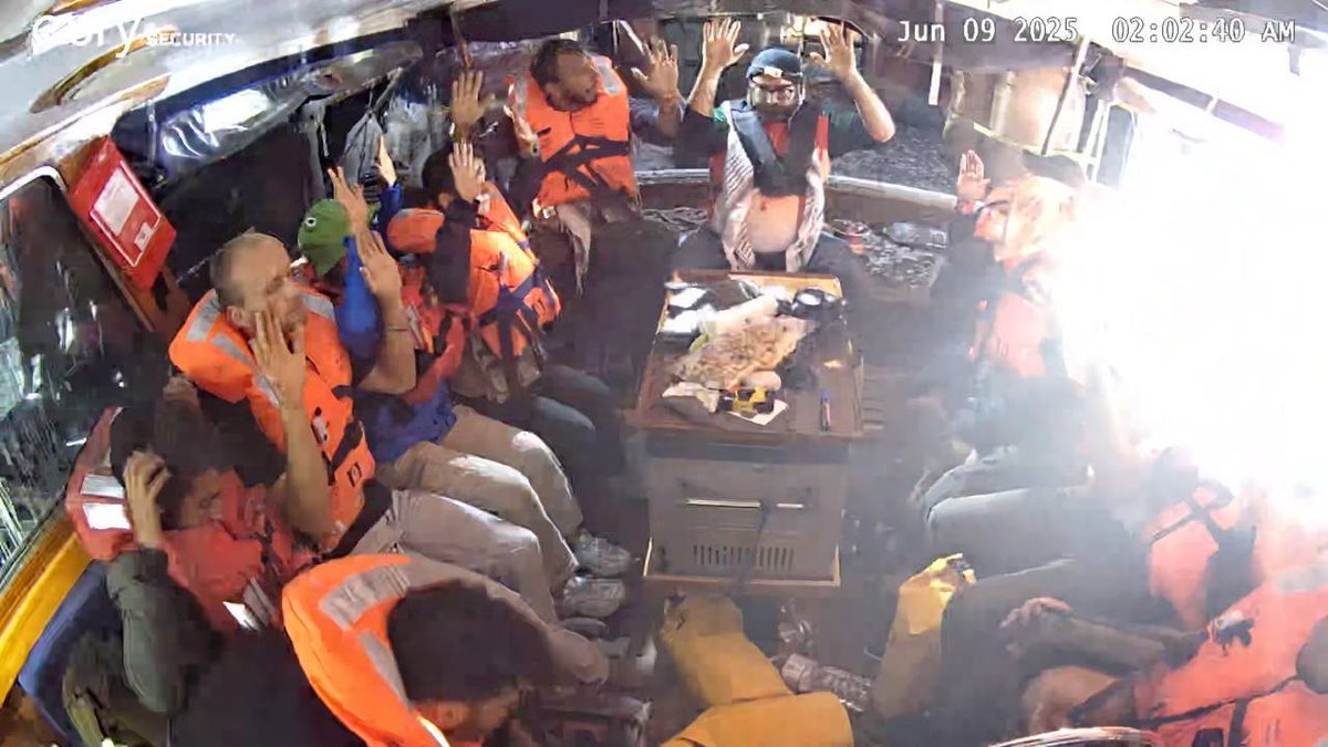 Freedom Flotilla crew as the IDF enters the 18 meter yacht, flying under a French flag as Barcarole