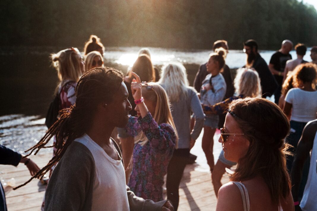 community of hipsters hanging out by the river