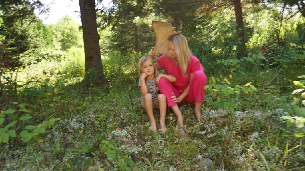 Karin kloosterman and son at their cabin the woods