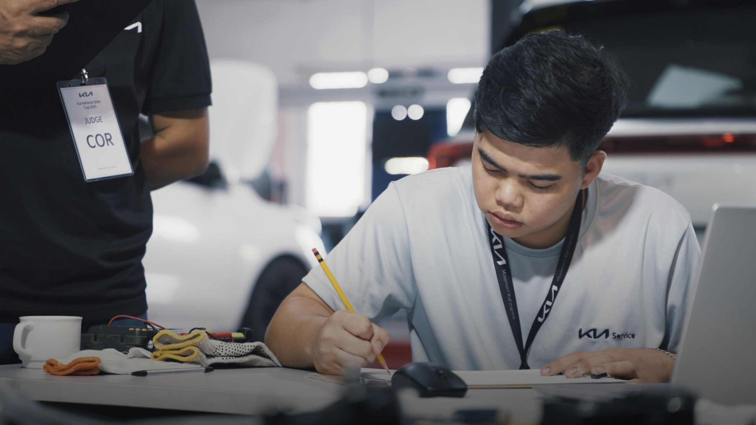 A student mechanic at the Kia Bootcamp program. Image supplied by Kia.