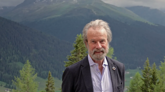 Konrad Steffen in front of mountains