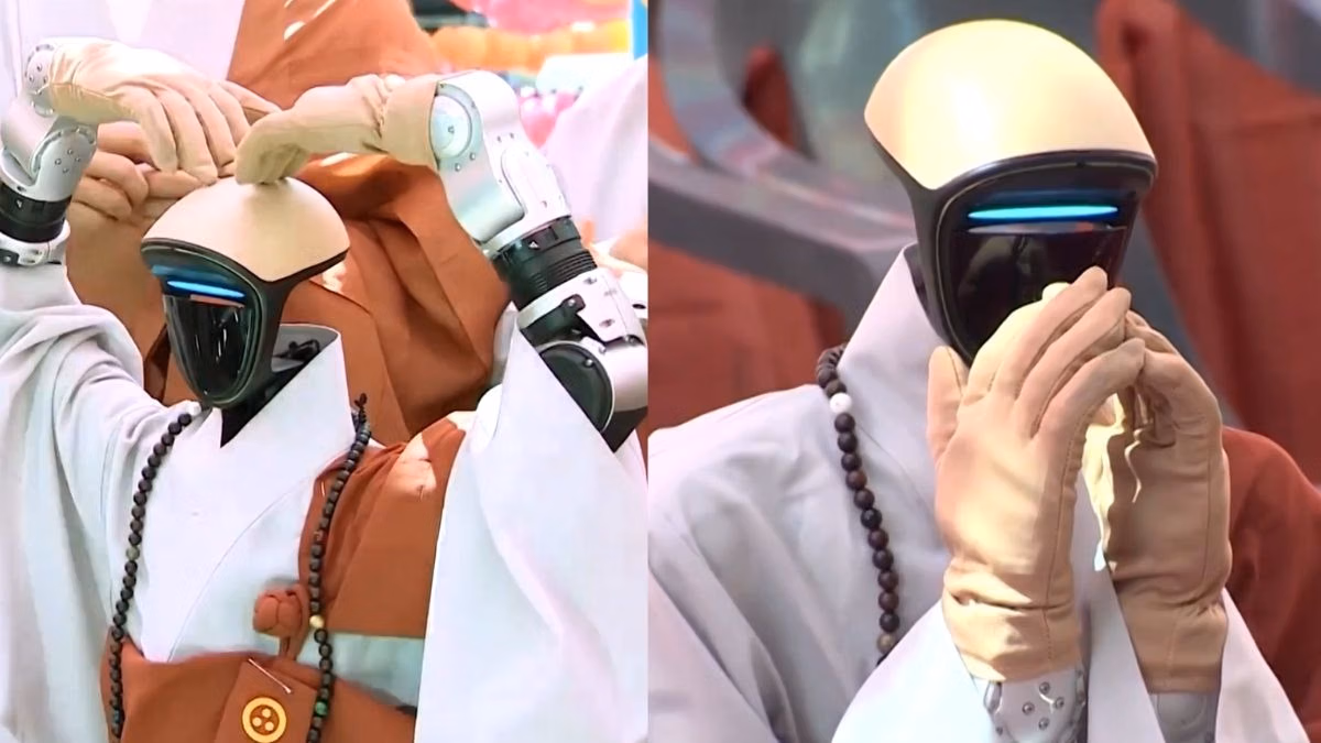 Close-up of Gabi’s mechanical hands in prayer – The robot monk’s articulated metal fingers are pressed together in the traditional Buddhist gesture of reverence and mindfulness.