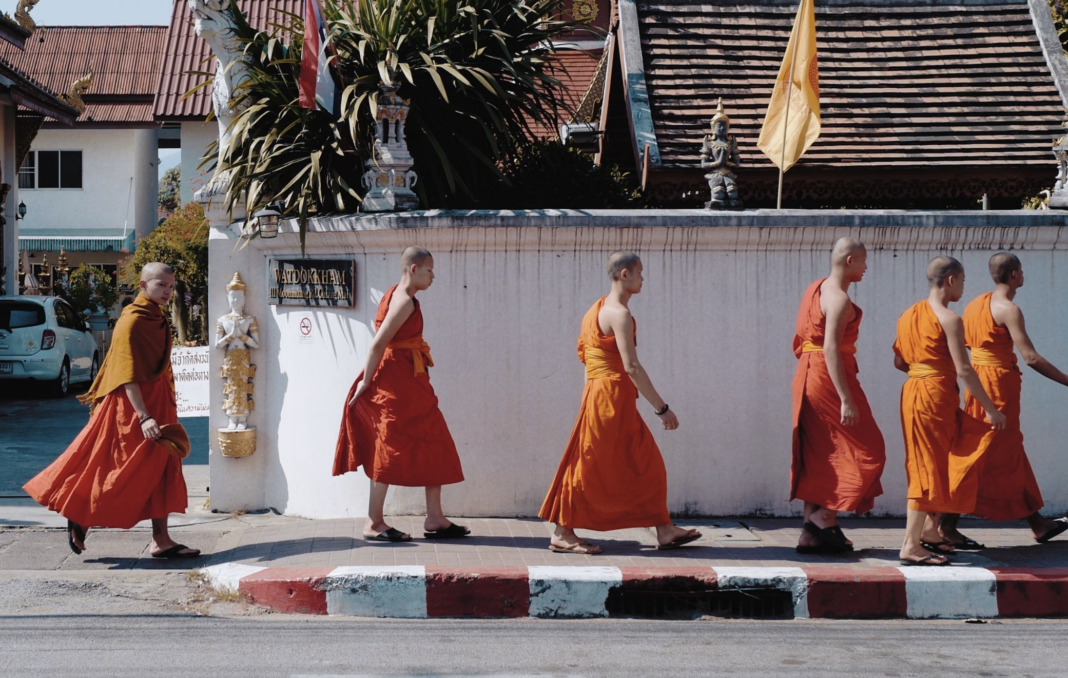 young monks outside a temple in Thailand