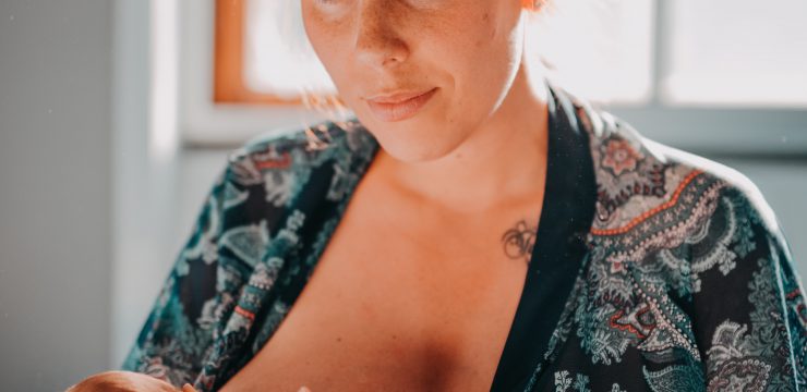 woman nursing or breastfeeding baby, plastic in beast milk