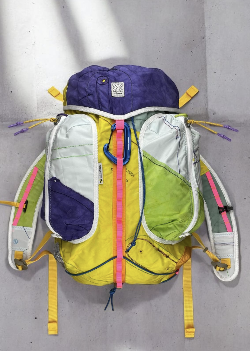 Pilsok beetle bag made from upcycled car airbag nylon, showing original seams and fabric codes, handmade in Kyiv Ukraine