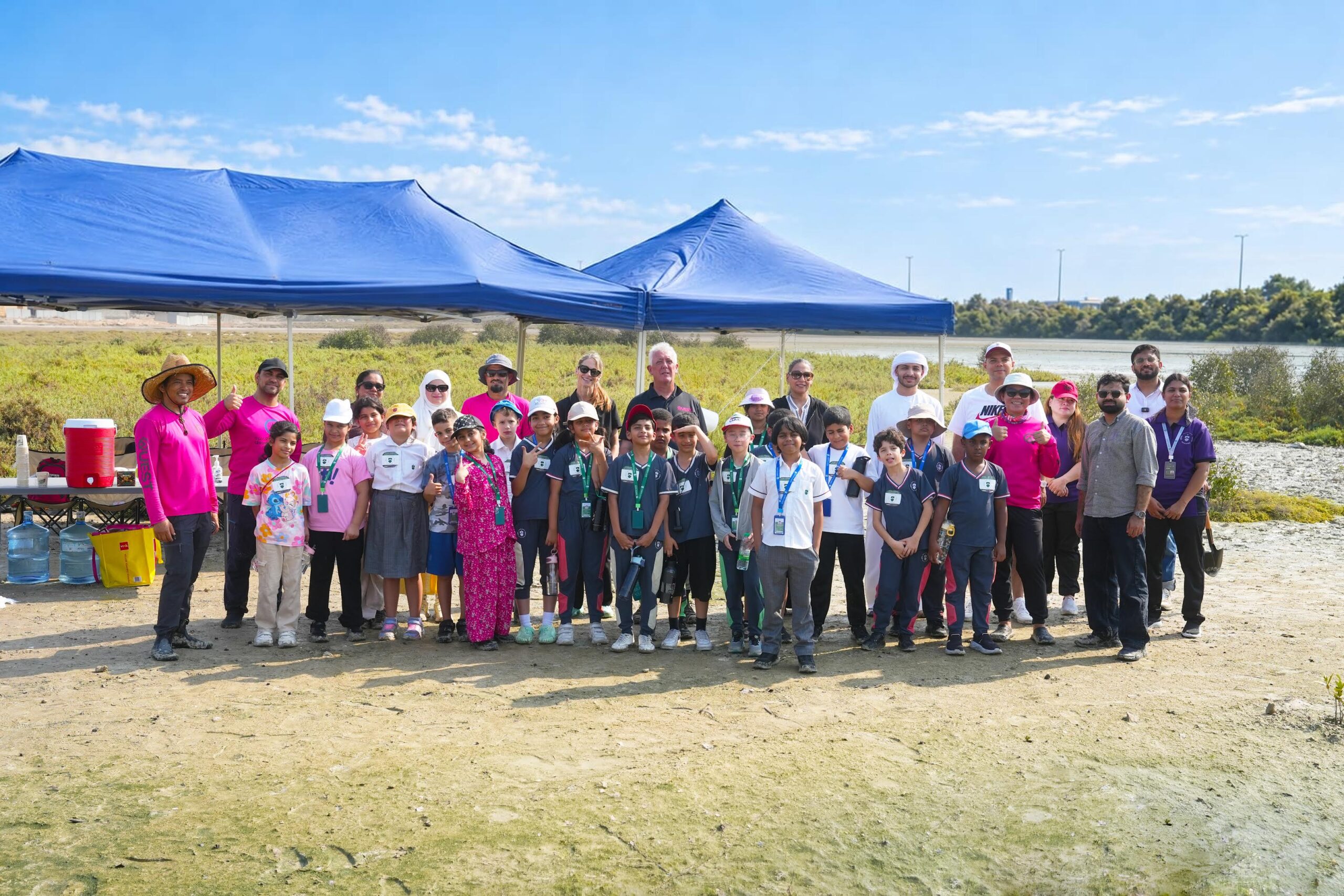 Students from North Gate British School plant mangrove saplings at Al Zorah Beach in Ajman, part of a wider effort to restore the UAE’s coastal ecosystems.
