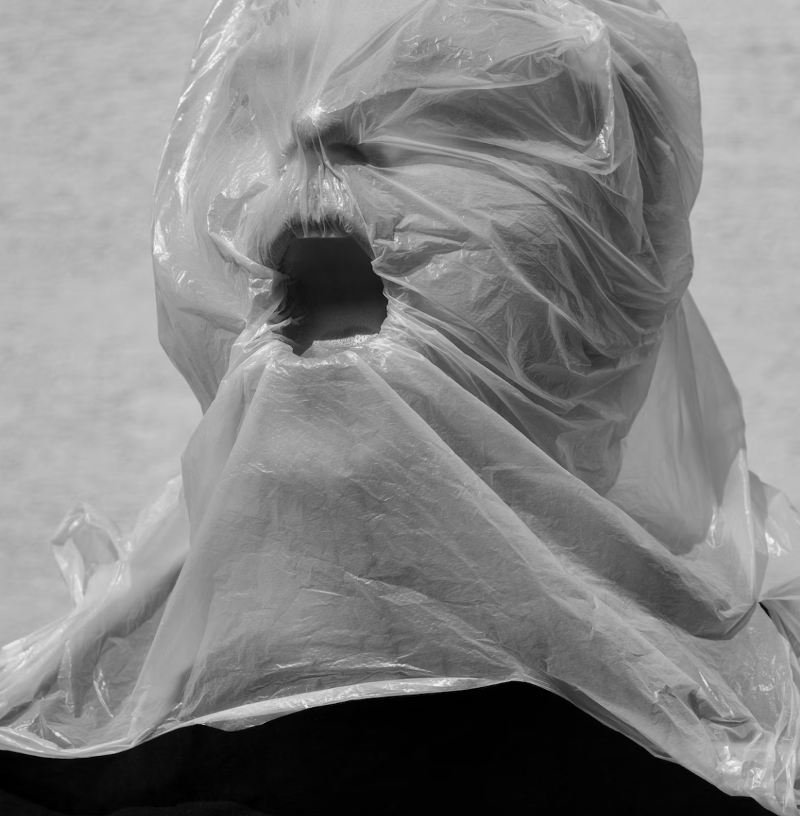 woman choking on a plastic bag