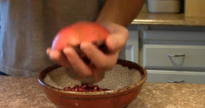 pomegranate deseed seeds wooden spoon