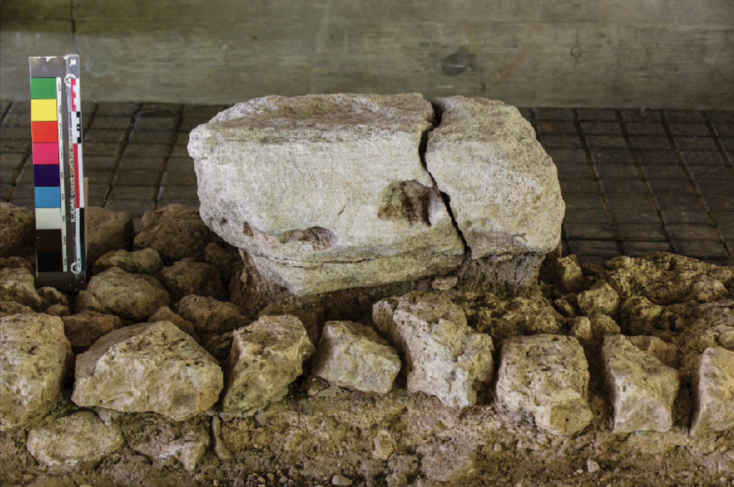 Kunrader limestone blocks forming the foundation of the porticus of the Roman baths of Coriovallum. The rough-hewn blocks are from a local quarry. A Norroy limestone pillar base rests atop them (photograph courtesy of Het Romeins Museum).