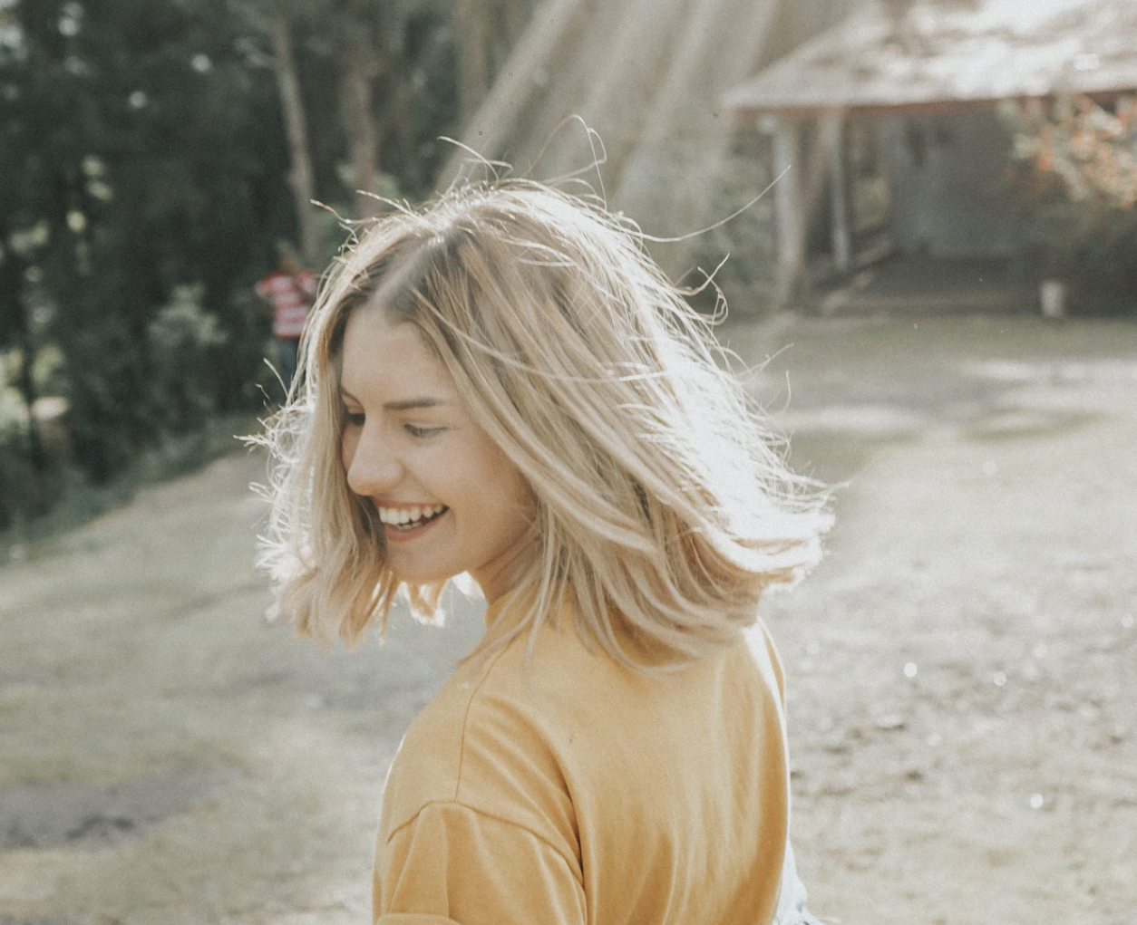 blond woman in the sun flirting