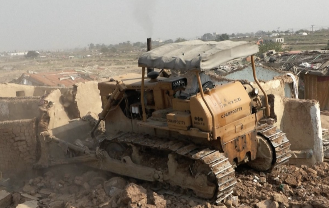 Bulldozer, mud home Pakistan