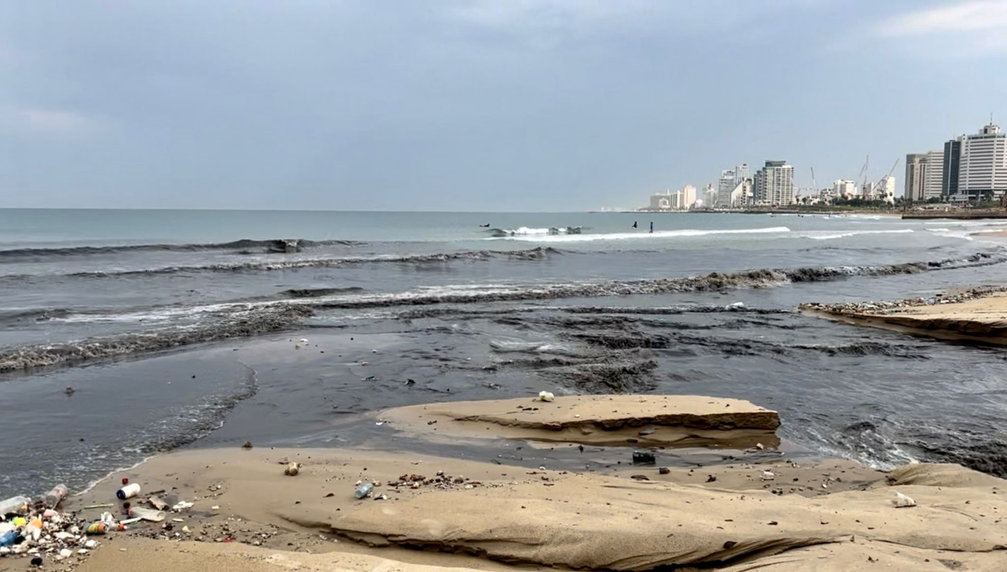 storm sewers open after rain, Jaffa beach, Tel Aviv, Israel, plastic on the sea