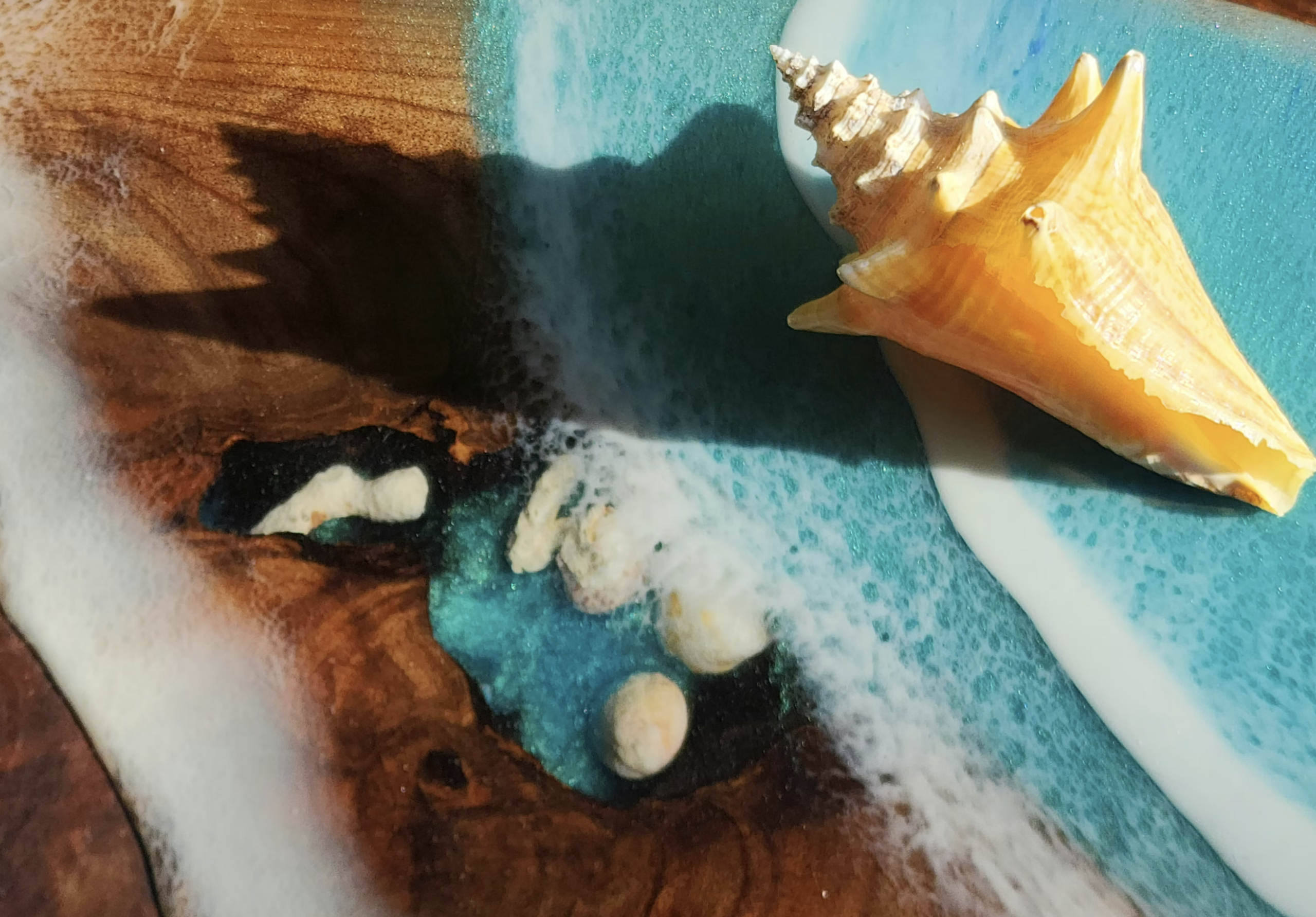 Resin charcuterie boards may look natural and handmade, but the epoxy sections are synthetic plastic and must be properly formulated and fully cured for food-contact use.