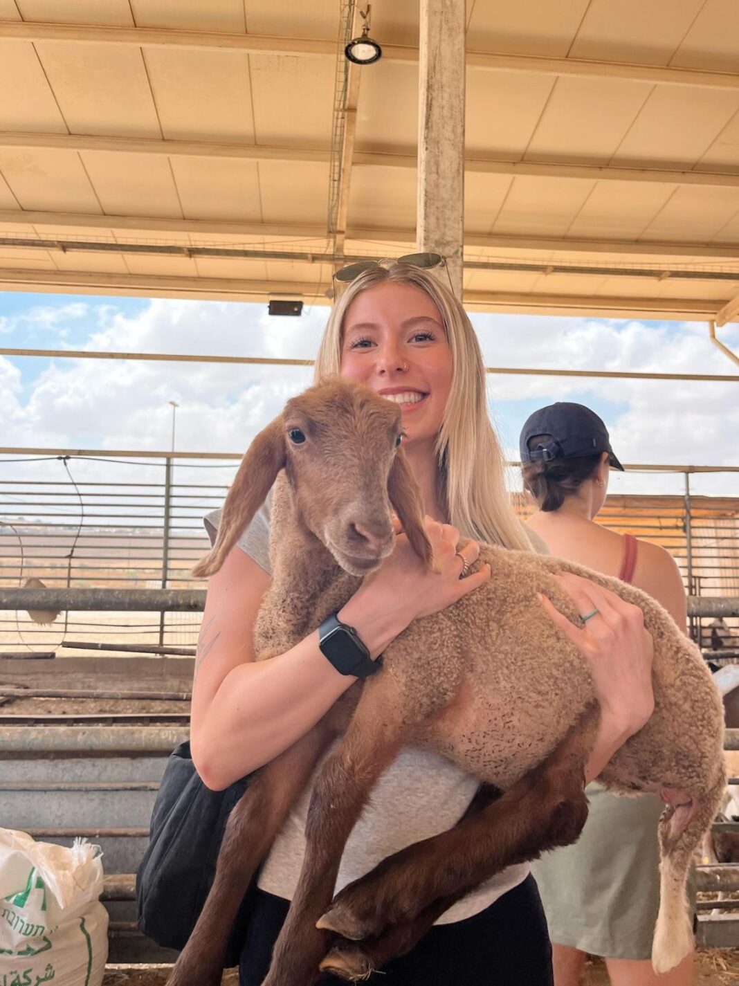 picture of friend in program holding one of the goats